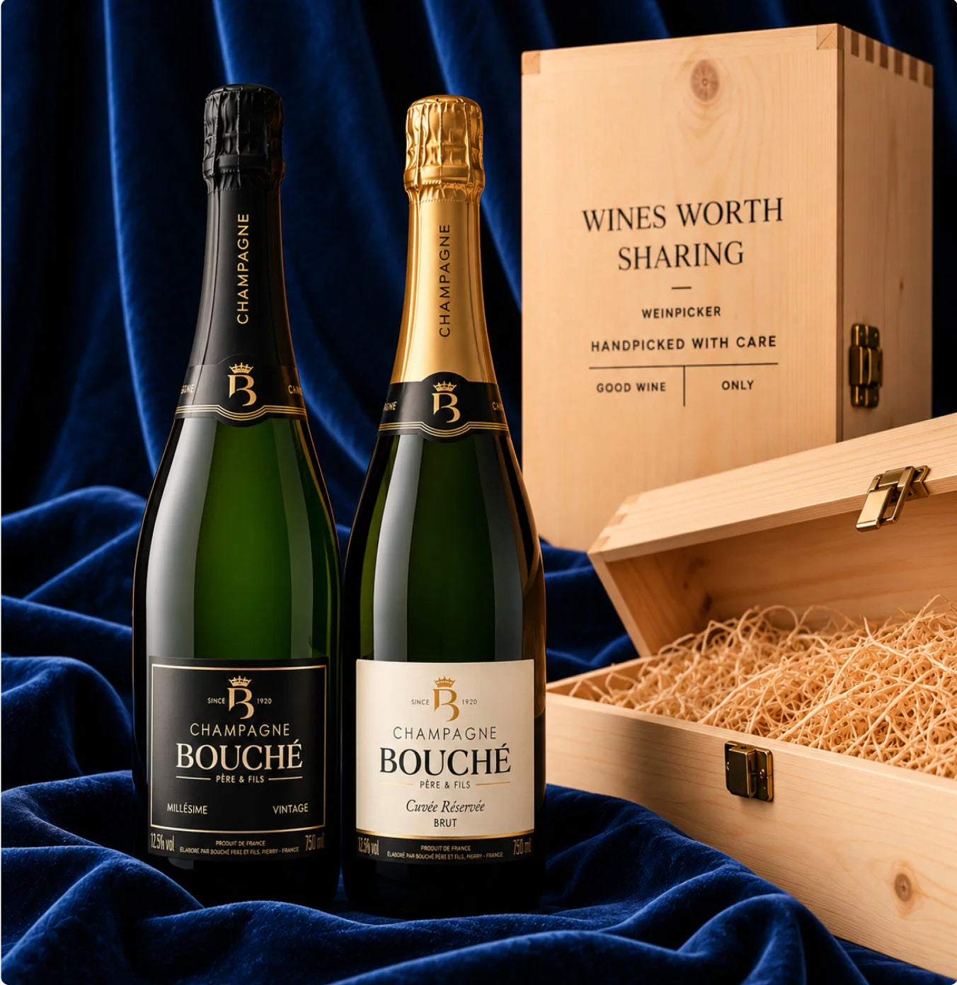 Two Champagne Bouché bottles, Cuvée Réservée Brut and Millésime Extra Brut, presented with an elegant wooden Weinpicker gift box against luxurious blue velvet.